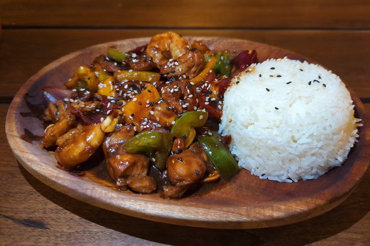 The Kung Pao Chicken comes with Mixed Peppers, Scallion, Chili and Peanuts served with Rice