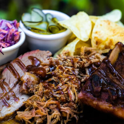 Chicken, ribs and pulled pork from El Cerado Pelon food truck restaurant at Palma Central in Tulum Mexico